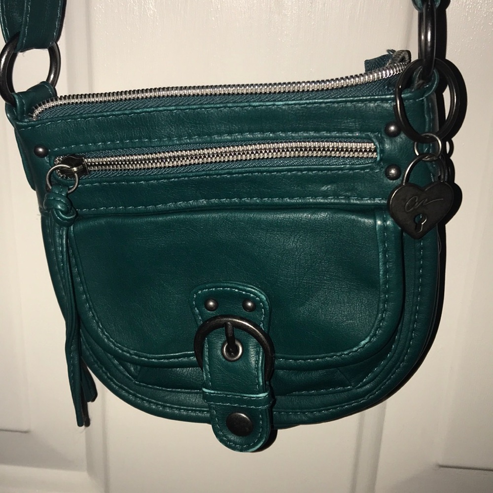 Small, teal American rag purse